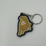 Lamborghini Bulle Schlüsselanhänger am Autoschlüssel auf Tisch platziert