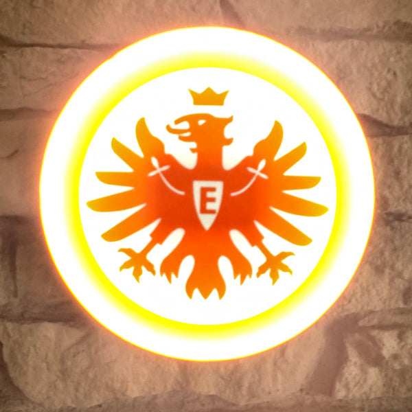 „Runde Lampe mit großem SGE-Adlerlogo vor weißem Hintergrund.“